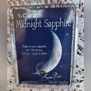 NEW IN PACKAGE APPROXIMATELY  1-CARAT SOPHIA FIORI MIDNIGHT SAPPHIRE OVAL 7X5 mm